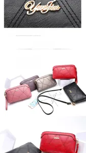 Detail of lychee textured leather bags with diamond stitching and golden logo