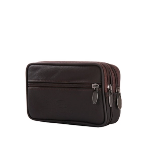 Detail view of the triple zipper compartments and texture on dark brown leather belt bag