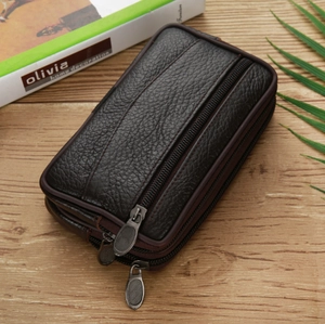 Detail of dark brown leather phone pouch showing three zippers and lychee texture