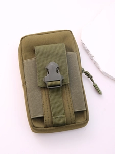 Detailed close-up of tactical nylon waist bag with sturdy buckle and smooth zipper