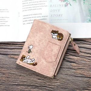 Pink denim style canvas wallet with cat embroidery and a leaf-shaped zipper pull