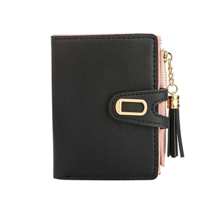 Detail of black pebbled faux leather bifold wallet with pink lining and tassel zipper