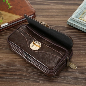 Detail of dark brown faux leather waist bag showing two zipper layers and golden twist lock