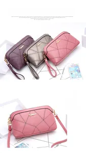 Detail of quilted women bags showing fine V-stitch texture and golden metal logo