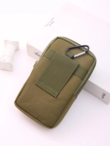 Detail view of military green tactical waist bag with MOLLE webbing and metal carabiner