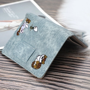 Detailed embroidery of cartoon cats chasing butterflies on grey-blue canvas wallet