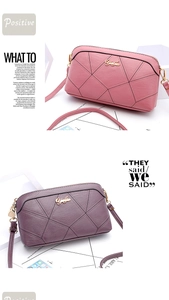 Detailed view of pink and purple shell bags with geometric stitching and gold logo