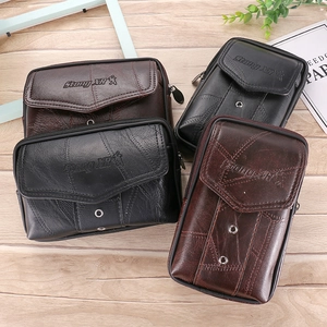 Close-up of vintage leather phone pouches with metal rivets and Stong XR logo