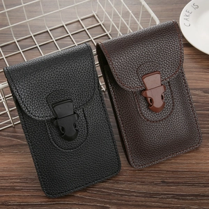 Close-up of black and brown men's leather phone holsters with buckle on wooden surface