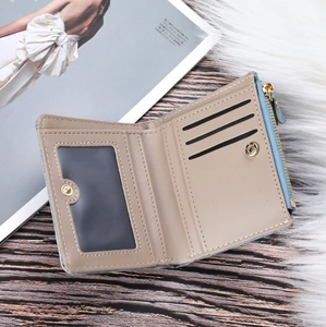 Internal structure of denim wallet showing card slots, ID window and zipper pocket