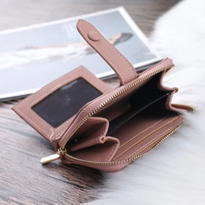 Detail view of pink PU leather wallet showing multiple card slots and internal layout
