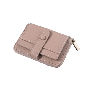 Detail of dusty pink leather wallet with white stitching and three card slots