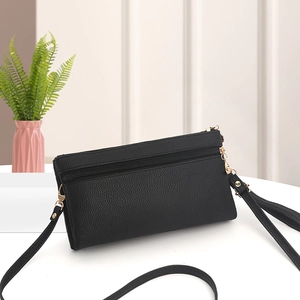 Chic black litchi pattern double layer crossbody bag with golden hardware and straps