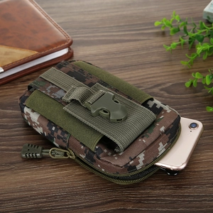 Tactical camouflage canvas waist bag showing phone storage capacity on a wooden surface