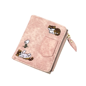 Close-up of pink denim style wallet with detailed cat embroidery and side coin zipper