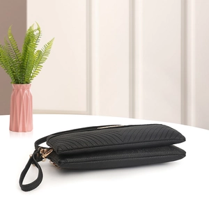Black quilted double zipper cross-body phone bag with golden hardware and wrist strap