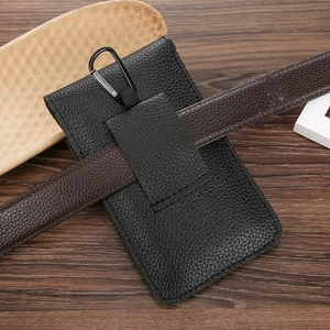 Detail view of black lychee grain leather phone pouch with belt loop and carabiner