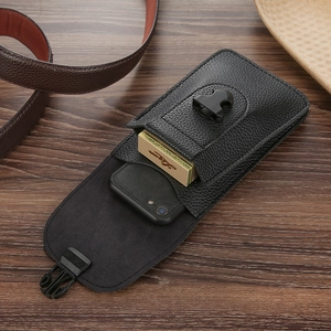 Detailed internal view of black leather phone belt pouch with buckle and dual compartments