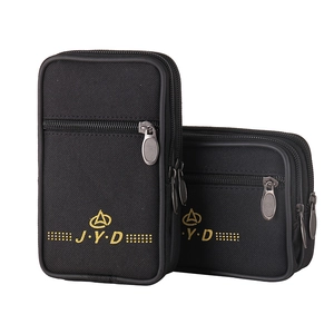 Close-up of waterproof canvas waist pouches with dual zippers and golden J.Y.D logo