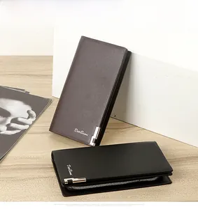 Detailed view of long leather men's wallets with zippers and metal corner accents