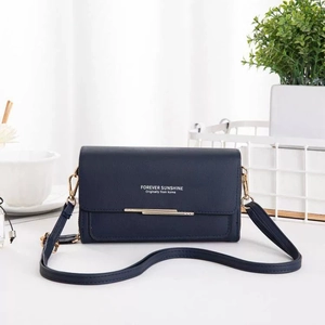Dark blue pebbled leather crossbody wallet featuring gold trim and slim shoulder strap