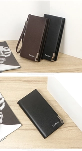 Close-up of classic long men's wallet in cross-grain texture with metal buckle
