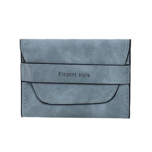 Detail of grey-blue matte wallet showing Elegant style text and flip-top clasp closure