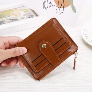Slim brown multi-slot card wallet for women with snap closure and zipper pocket
