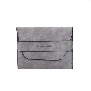 Detailed close-up of grey frosted texture card holder with Elegant style printed strap