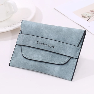 Detail view of a matte grey-blue folding wallet with Elegant Style strap and snap closure