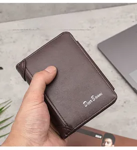 Macro detail of dark brown leather texture and stitching on a compact men's wallet