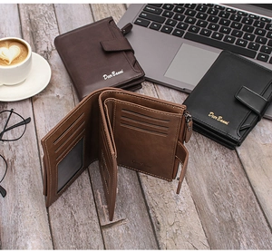Three men's slim wallets with multi-card slots and coin pocket on a wooden desk