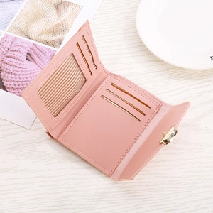 Detail view of pink PU leather wallet interior with three card slots and metal clasp
