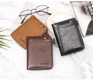 Three-color men's zip wallets in black and brown leather on a marble desk surface