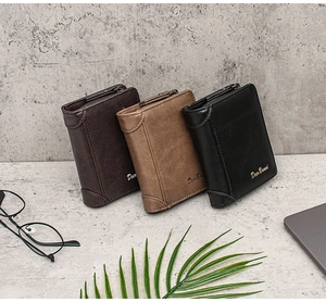 Close-up of three trifold wallets in black and brown leather on an office desk