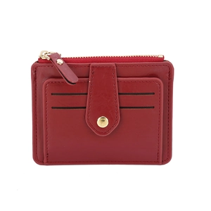 Detail view of red slim wallet showing multiple card slots and secure gold metal zipper