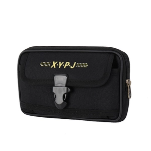 Detail of black canvas waist bag showing quick-release buckle and multi-layer zipper