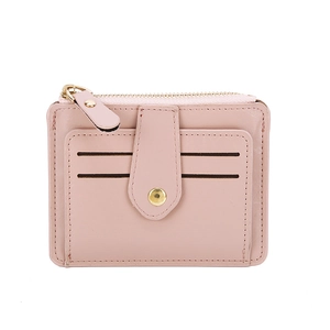 Close-up of slim dusty rose pink card holder featuring four slots and gold zipper detail