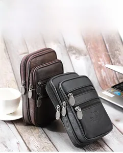 Détail d'une pochette ceinture en cuir pour homme avec triple zip et logo tête de taureau