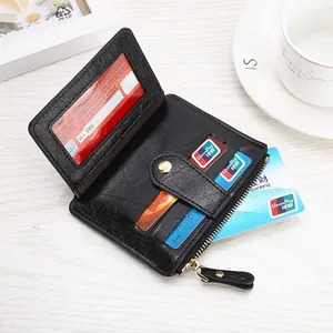 Detail view of black litchi pattern leather wallet with card slots and gold zipper
