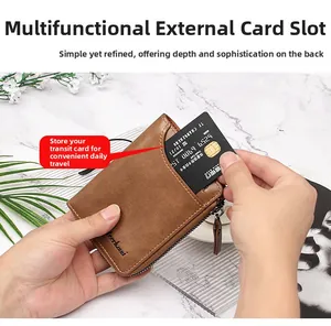Brown leather wallet detail showing the external card slot and smooth metal zipper