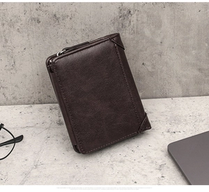 Macro detail of dark brown leather texture and metal zipper closure on men's wallet