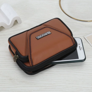 Brown leather smartphone belt pouch for men with orange stitching and zipper closure