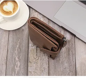 Macro view of dark brown leather wallet showing precise stitching and card slot details