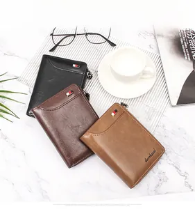 Detailed view of luxury men's wallets in black and brown leather with zippers and metal logo