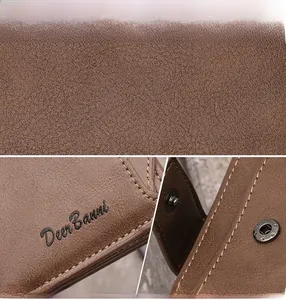 Detail of dark brown lychee leather wallet with Deer Banni logo and metal snap button