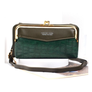 Detail of green stone pattern crossbody phone bag with vintage gold metal clasp and strap