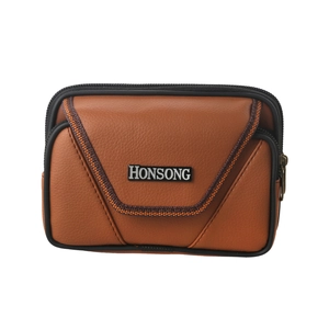 Detailed view of the brown leather belt pouch with a zipper and metal brand plaque