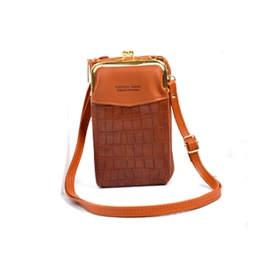 Detail of brown faux leather phone bag featuring crocodile pattern and gold metal clasp