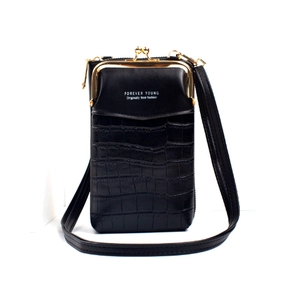 Detail of black crocodile texture phone bag with gold metal clasp and zipper closure